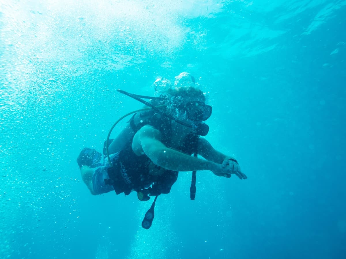 A diver in clear blue open water